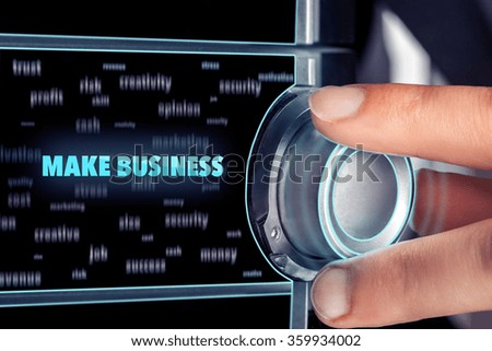 businessman choosing MAKE BUSINESS button on dashboard. Business concept