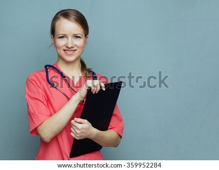 Doctor woman with medical records. Medical doctor woman on a blue background smiling