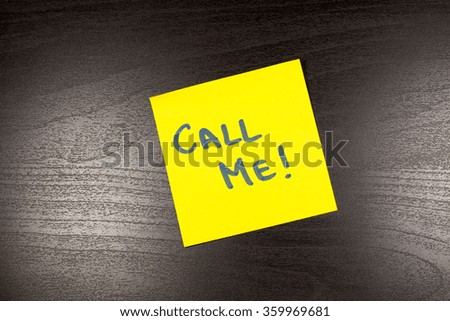 Call Me sticky note on black background