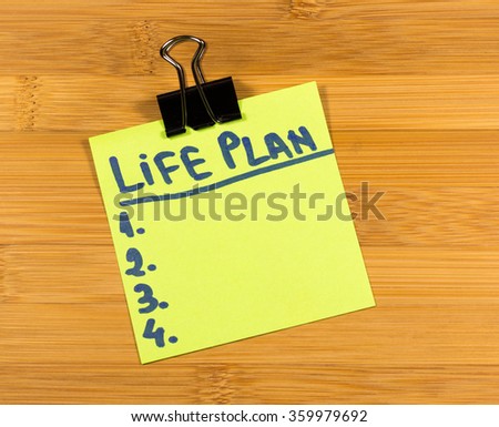life plan sticky note on wooden background