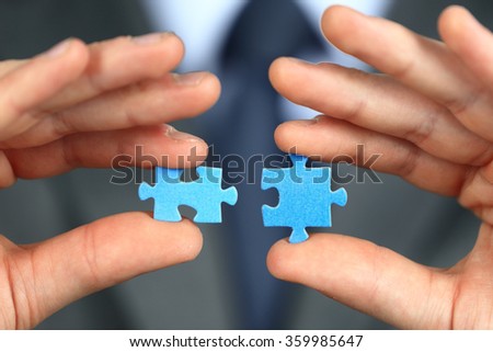 Hands with two puzzles