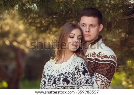 Young couple in love outdoor. Portrait of Smiling Beauty Girl and her Handsome Boyfriend. Happy Joyful Family. Love Concept.  Laughing Happy Lovers. Valentines Day