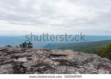 Standing empty on top of a mountain view with clouds before storm at Phu Kradueng National Park, Loei Province, Thailand