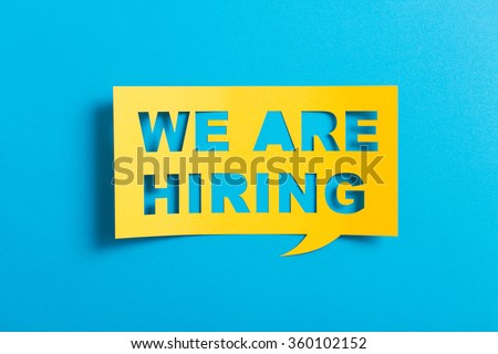 Bubble speech with cut out phrase "we are hiring"  in the paper. Royalty-Free Stock Photo #360102152