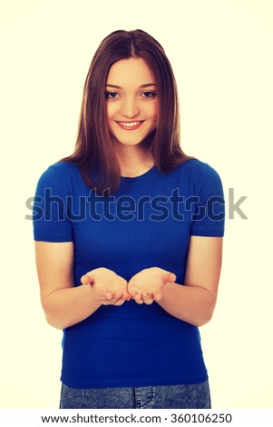 Smiling woman showing something on palms.