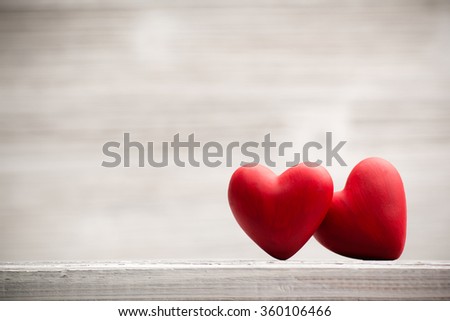 Red heart on the wooden  background.