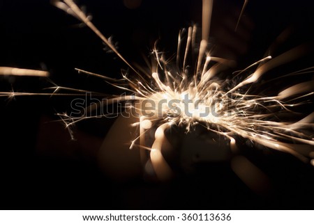 Glowing Flow of sparks in the Dark in motion. Sparkling stars dust trail (light effect)