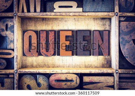 The word "Queen" written in vintage wooden letterpress type.