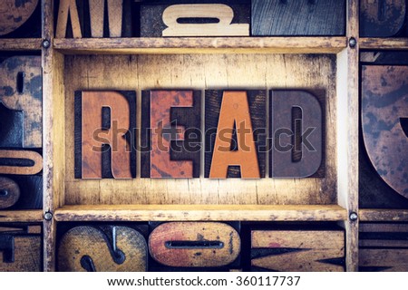 The word "Read" written in vintage wooden letterpress type.