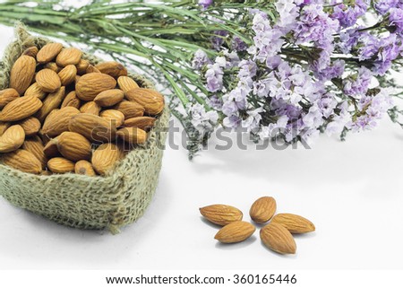 Almond grains on white clean table, stock photo