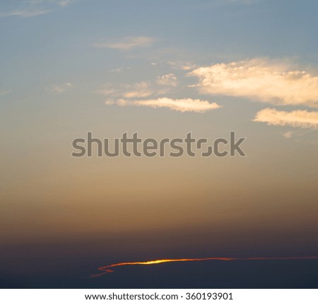 in the red blue sky cloud and sunrise       orange color