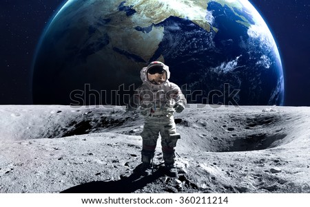 Brave astronaut at the spacewalk on the moon. This image elements furnished by NASA. Royalty-Free Stock Photo #360211214