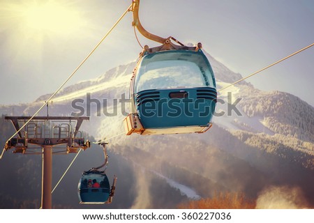 blue cable car lift at ski resort. vintage winter picture