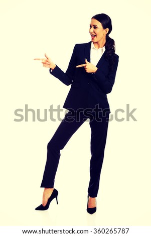 Businesswoman pointing to the left