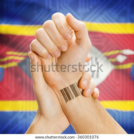 Barcode ID number on wrist of a human and national flag on background series - Swaziland