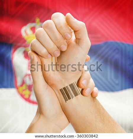 Barcode ID number on wrist of a human and national flag on background series - Serbia