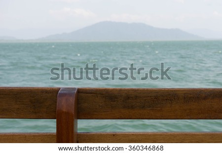 wooden fence ,blur sea view background, pale picture