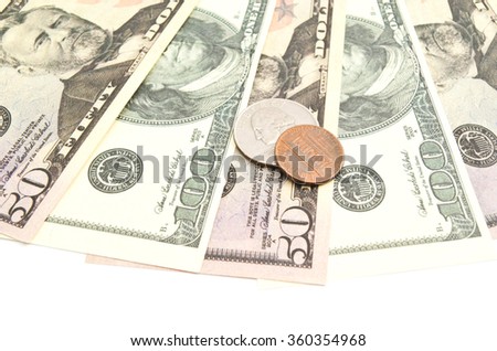 dollars banknotes and coins closeup on white background