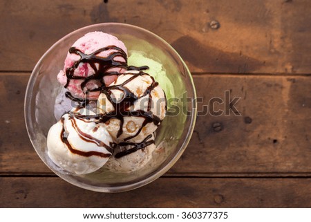 colorful ice cream scoop in glass bowl, top view, selective focused