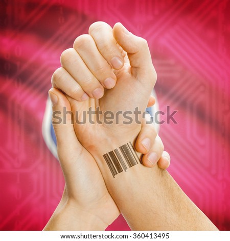 Barcode ID number tattoo on wrist and USA states flag on background series - Tennessee