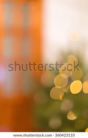 Blurred background Christmas tree next to door