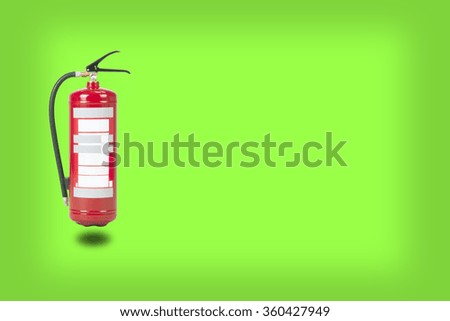 Fire extinguisher on green background