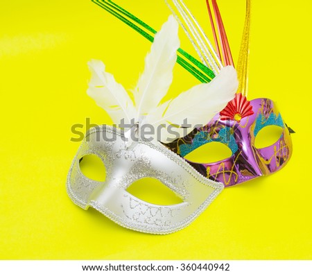 Carnival masks isolated on yellow background