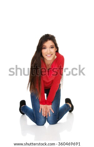 Relaxing woman sitting on the floor.