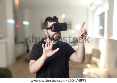 Guy using vr glasses Royalty-Free Stock Photo #360474893