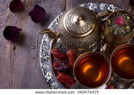 Traditional arabic tea set and dried dates. 