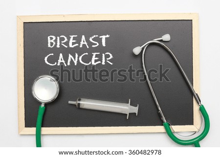 BREAST CANCER concept with stethoscope and syringe