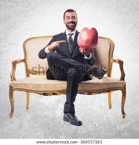 Businessman holding a piggybank