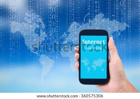 Man hand holding mobile phone for internet marketing with digital sky background