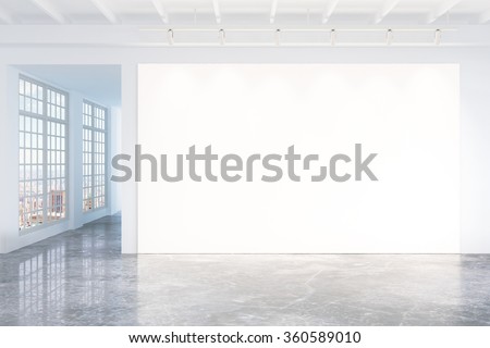 Blank white poster on white wall in empty loft room with concrete floor and big windows, mock up 3D Render