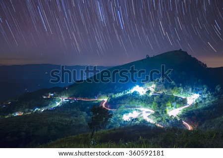 Star trails over Doi Pha Tang, Chiang Rai, Thailand.