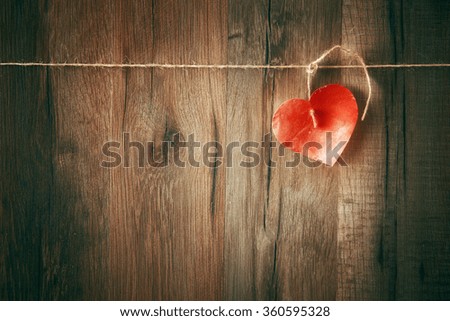 paper heart on wooden background. the concept of love and Valentine's day.