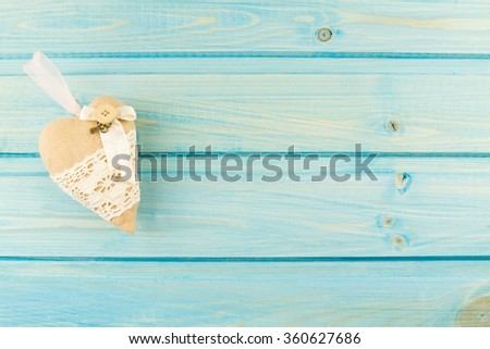 handmade heart on a blue wooden background. Valentine's day