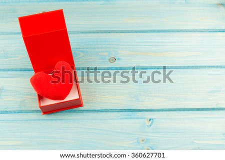 red heart on a blue wooden background. Valentine's day
