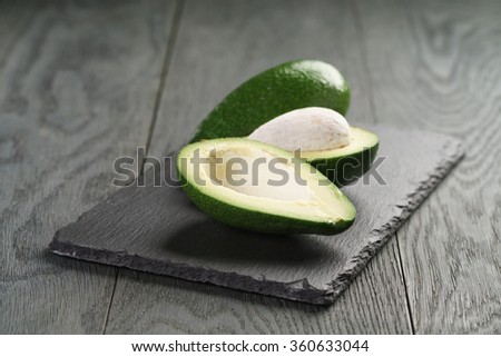 ripe avocados on slate board