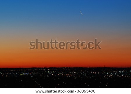 Beautiful clean and serene sky and moon before sunrise, city edmonton, alberta, canada