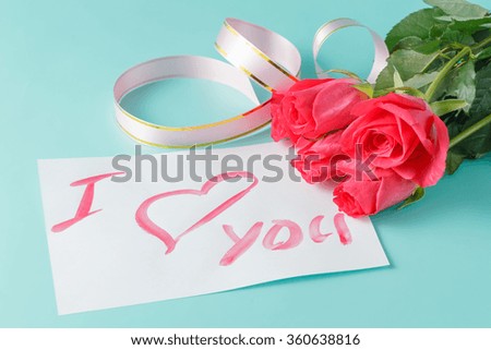 Letter with love note, red rose with hearts