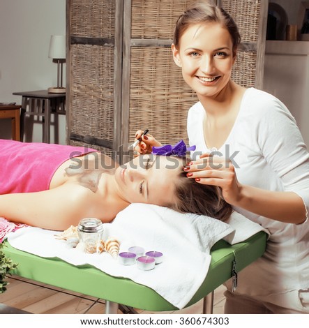 stock photo attractive lady getting spa treatment in salon, massage doctor smiling care pretty