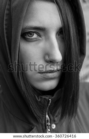 The cowled girl. Close up. Black and white