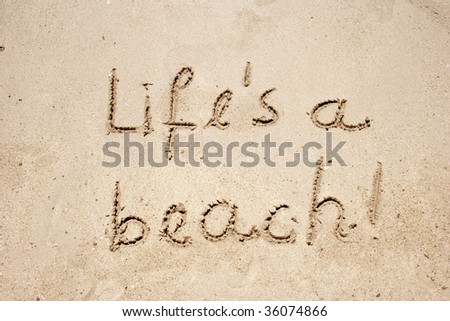 Life`s a beach handwritten in sand for natural, symbol,tourism or conceptual designs