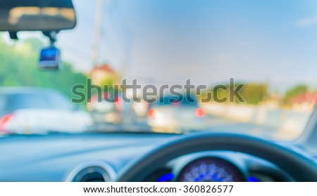 blur image of inside cars with bokeh on day time for background usage .