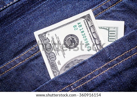Pocket money background. Hundred dollar bill. Money in blue jeans trousers. Cash in trousers. Savings background. American currency banknote.