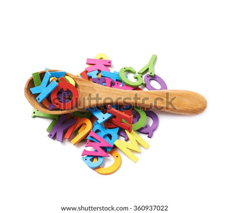 Pile of colorful wooden letters isolated