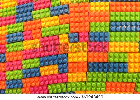 Old Used Colorful Plastic Toy Building Brick Block Pattern for Puzzle used as Background Texture
