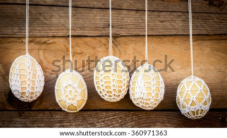 Crochet pattern Easter eggs on wooden background