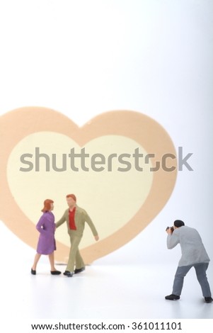 miniature of photographer taking pictures of an heterosexual couple - Valentine's day concept